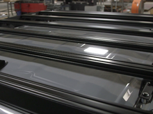 Load image into Gallery viewer, Top down close up of gray Toyota Tacoma with Premium roof rack - Cali Raised LED